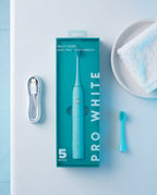 Pro White Multi-Mode Sonic Electric Toothbrush — lifestyle flat lay