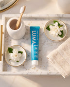 Pro White Luma1 Whitening Toothpaste — lifestyle flat lay