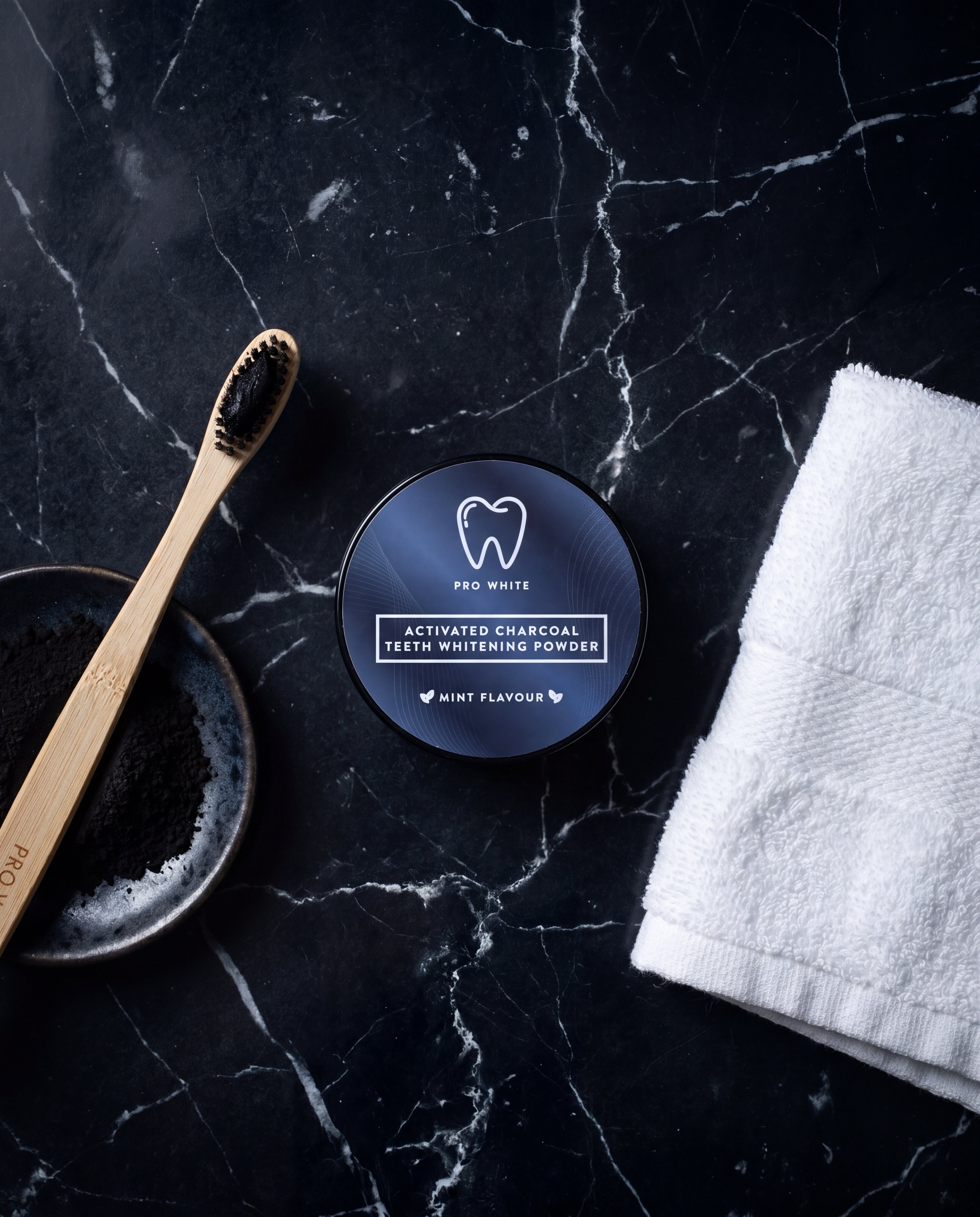 Pro White Activated Charcoal Teeth Whitening Powder — lifestyle flat lay